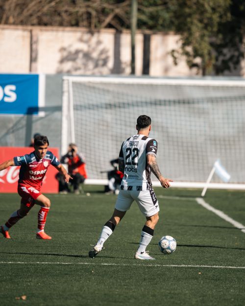 Free A competitive soccer match with players in action on the field, showcasing sportsmanship and teamwork. Stock Photo