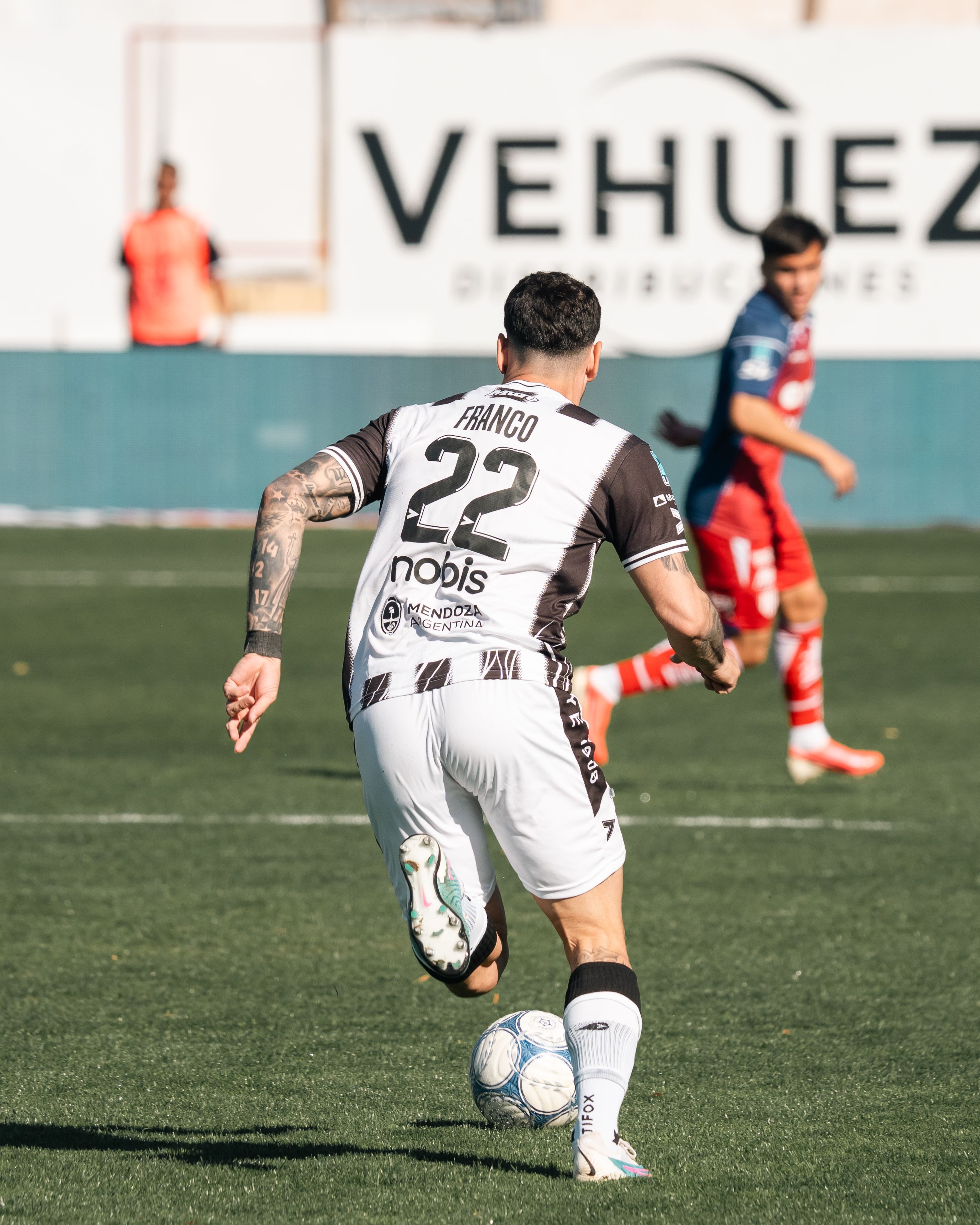 Exciting moment in a soccer match as players engage on the field.