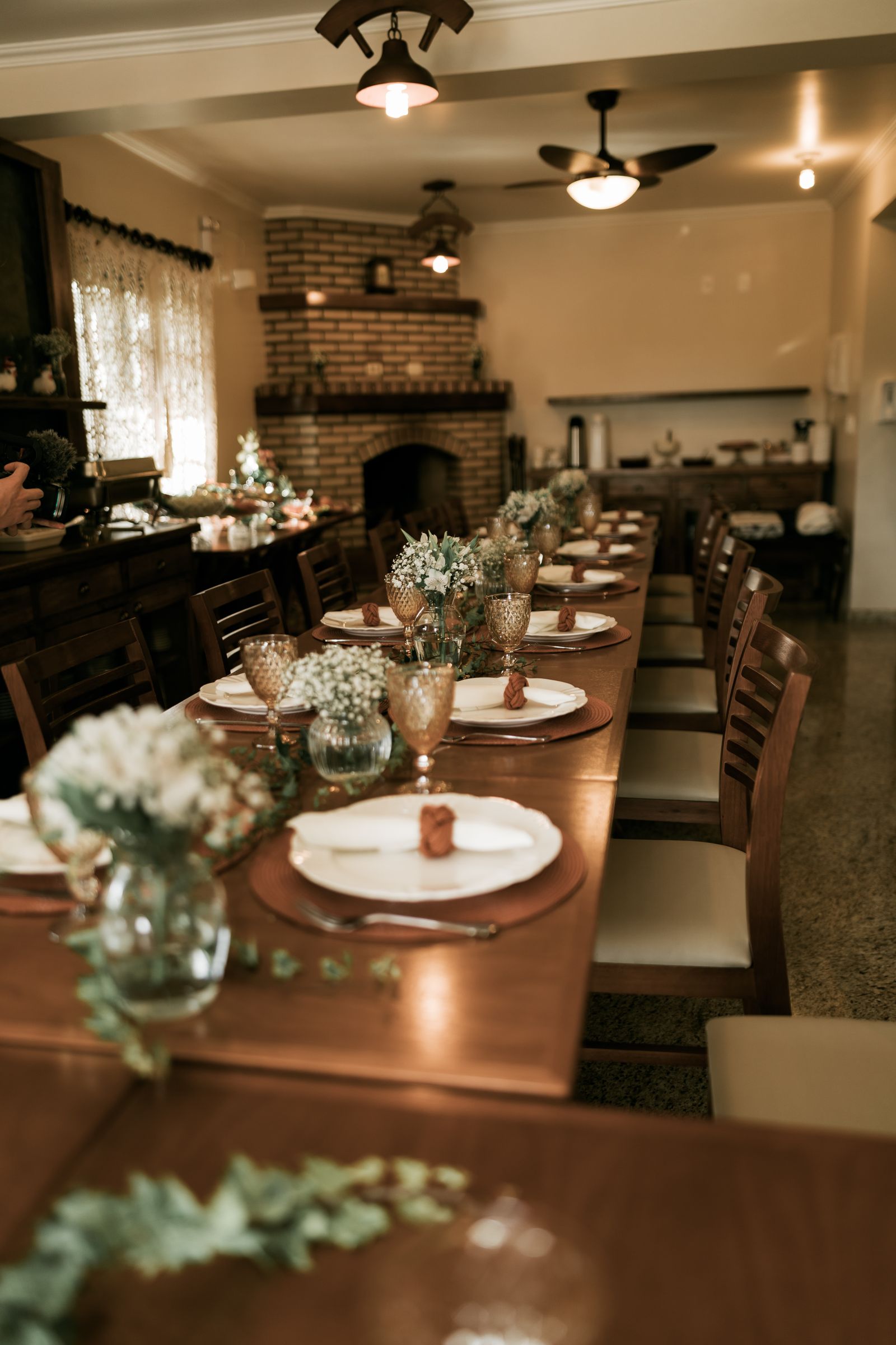 An elegantly set family dinner table with empty chairs waiting to be filled