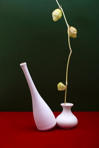 Two pale ceramic vessels in a colour-blocked still life — photo by Valentin Ivantsov on Pexels