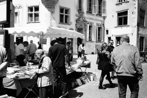 Free Black and white photo capturing a bustling book market in Nancy, Grand Est, France. Stock Photo