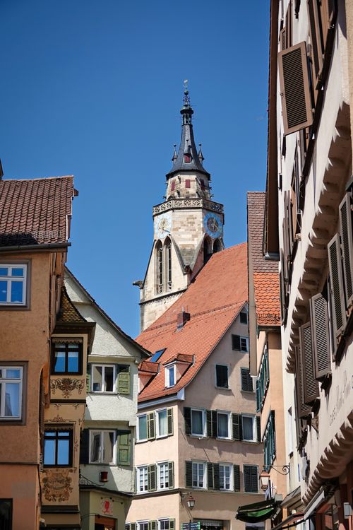 Free Scenic view of St. George's Collegiate Church tower amid historic buildings in Tübingen, Germany. Stock Photo