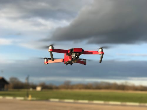 Free Red and White Drone Flying Stock Photo
