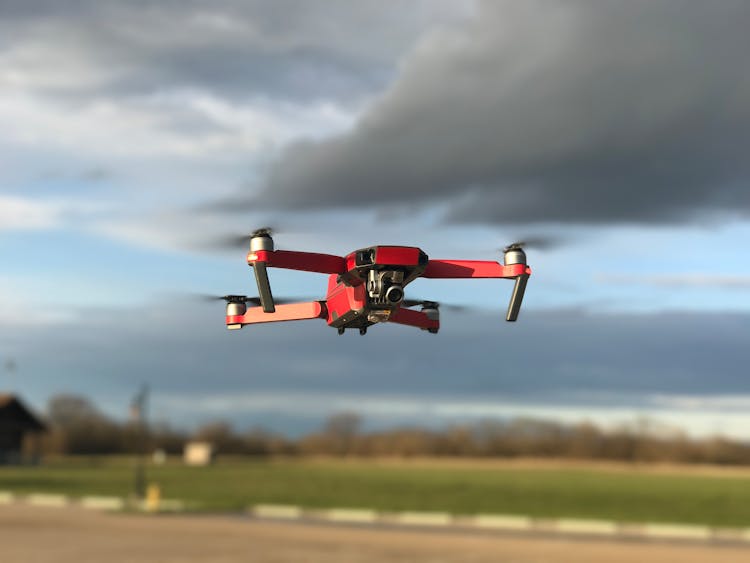 Red And White Drone Flying