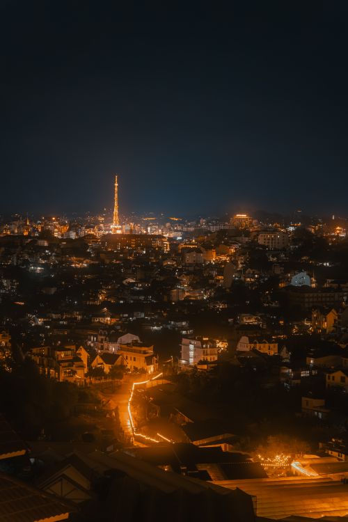Free Breathtaking night cityscape of Xuan Huong Lake in Da Lat, Vietnam, illuminated in warm lights. Stock Photo