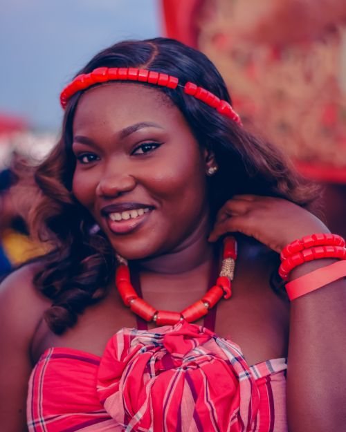 Free Smiling African woman in colorful traditional attire at cultural event in Abuja, Nigeria. Stock Photo