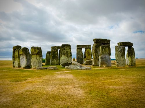 Free Ancient monument Stonehenge stands stoically under a cloudy sky in England. Stock Photo