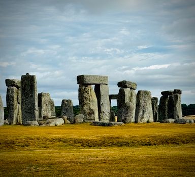 Capture of the iconic Stonehenge with tall stone structures under a tranquil sky.