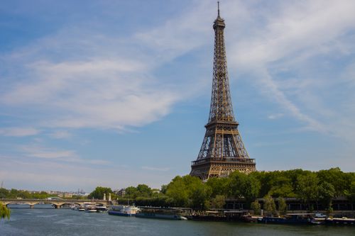 Free Stunning view of the Eiffel Tower from the Seine River in Paris, France. Stock Photo