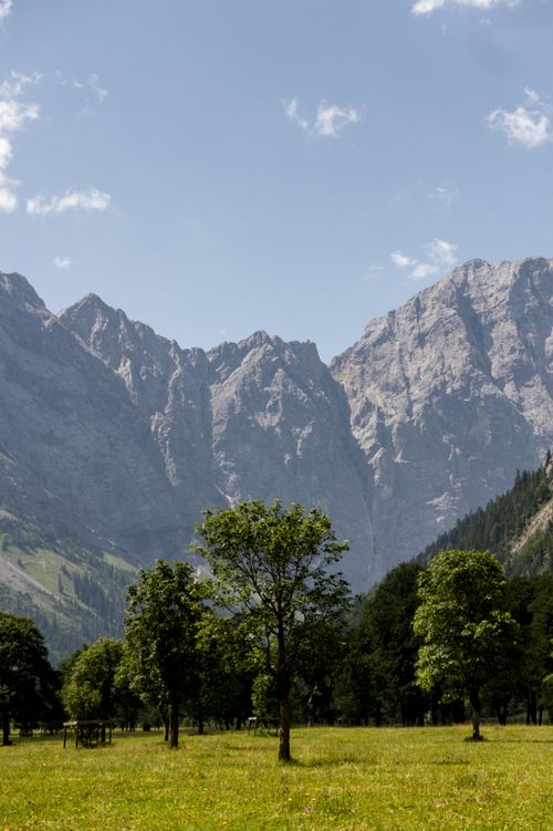Free Captivating view of the lush alpine valley and towering mountains in Tyrol, Austria. Stock Photo