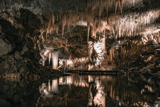 Explore the intricate stalactite formations in a breathtaking Australian cave scene.