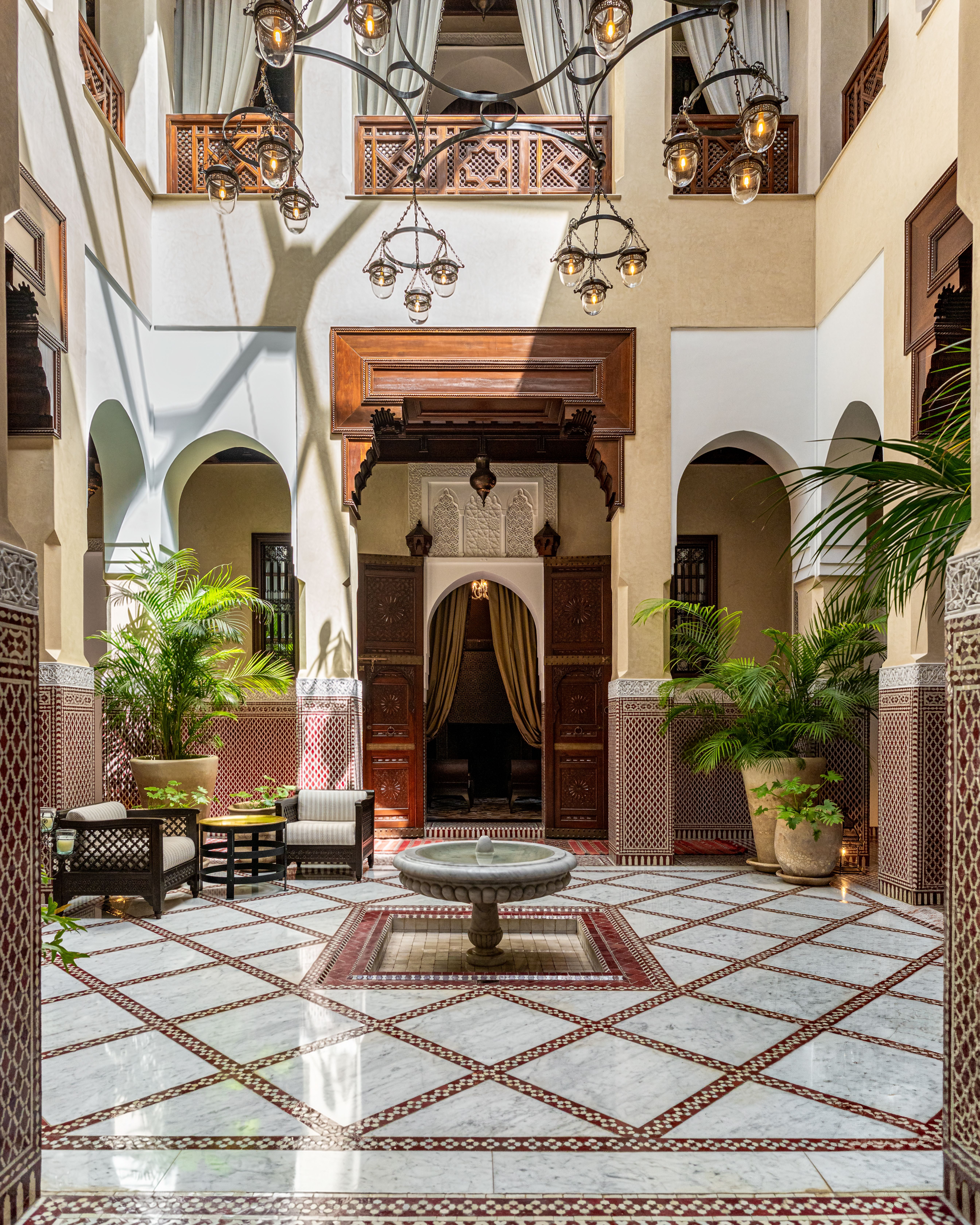 Tiled courtyard with planting, photo by Philippe Lasry on Pexels