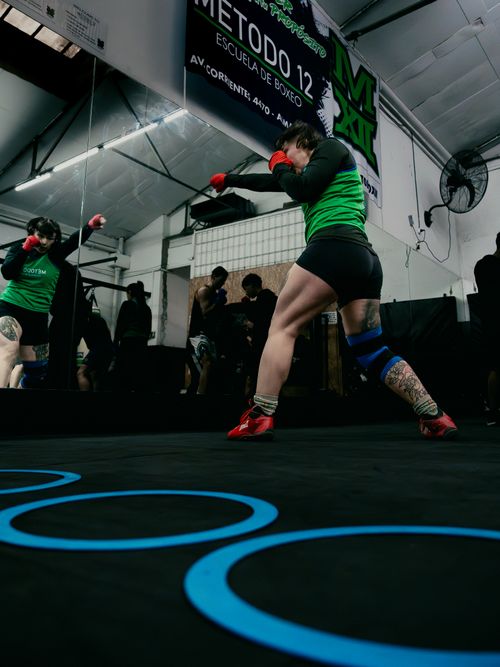 Free Female boxers practicing at a Buenos Aires boxing school, focusing on workout techniques. Stock Photo