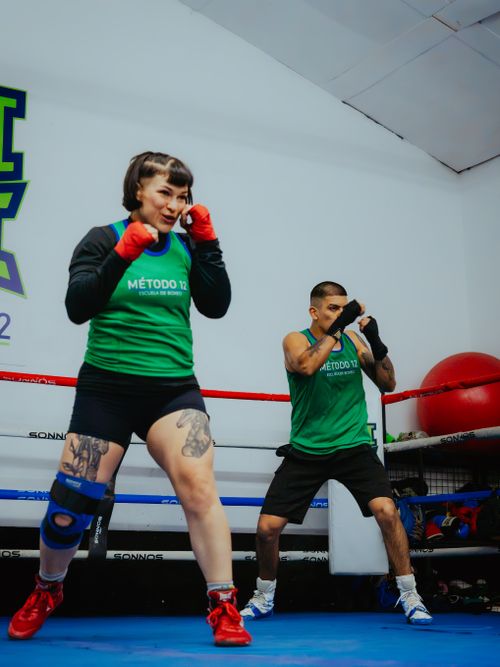 Free Female and male boxers practicing their moves in a Buenos Aires gym. Stock Photo