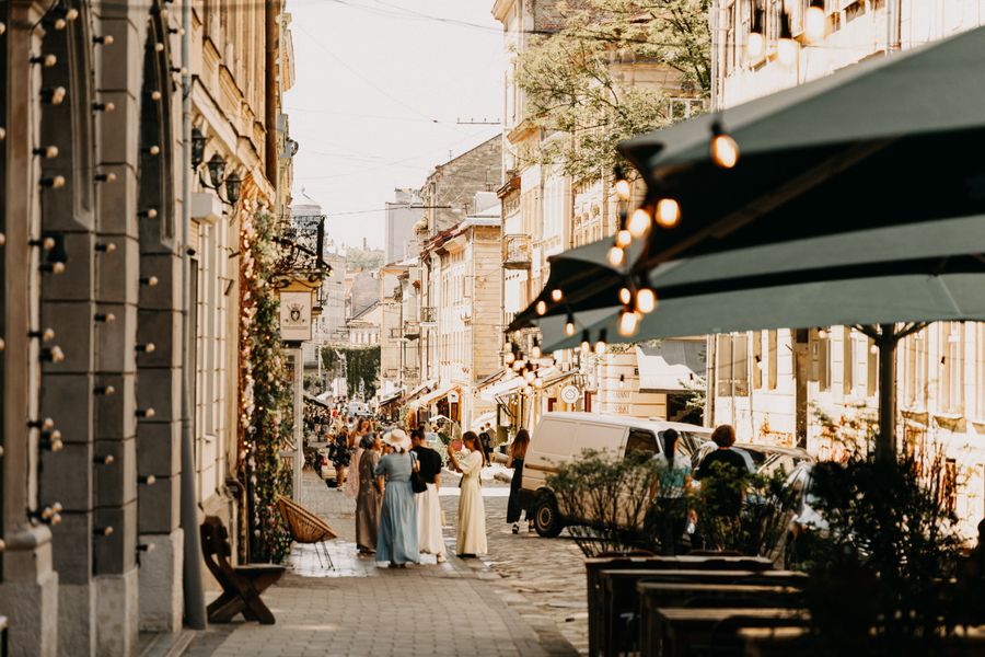 Picturesque street in Lviv, Ukraine, showcasing historic architecture and vibrant urban life.