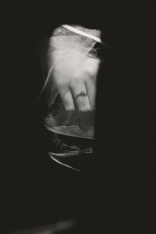 Free Black and white photo of a veiled hand with a ring, creating a mysterious and artistic mood. Stock Photo
