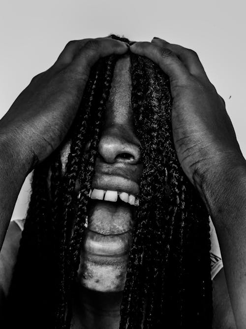 Grayscale Photo Of Man's Face Covered With Hair