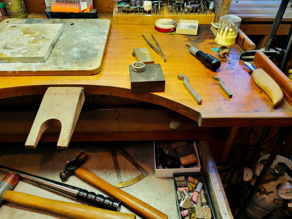 A jeweller's workbench with tools laid out
