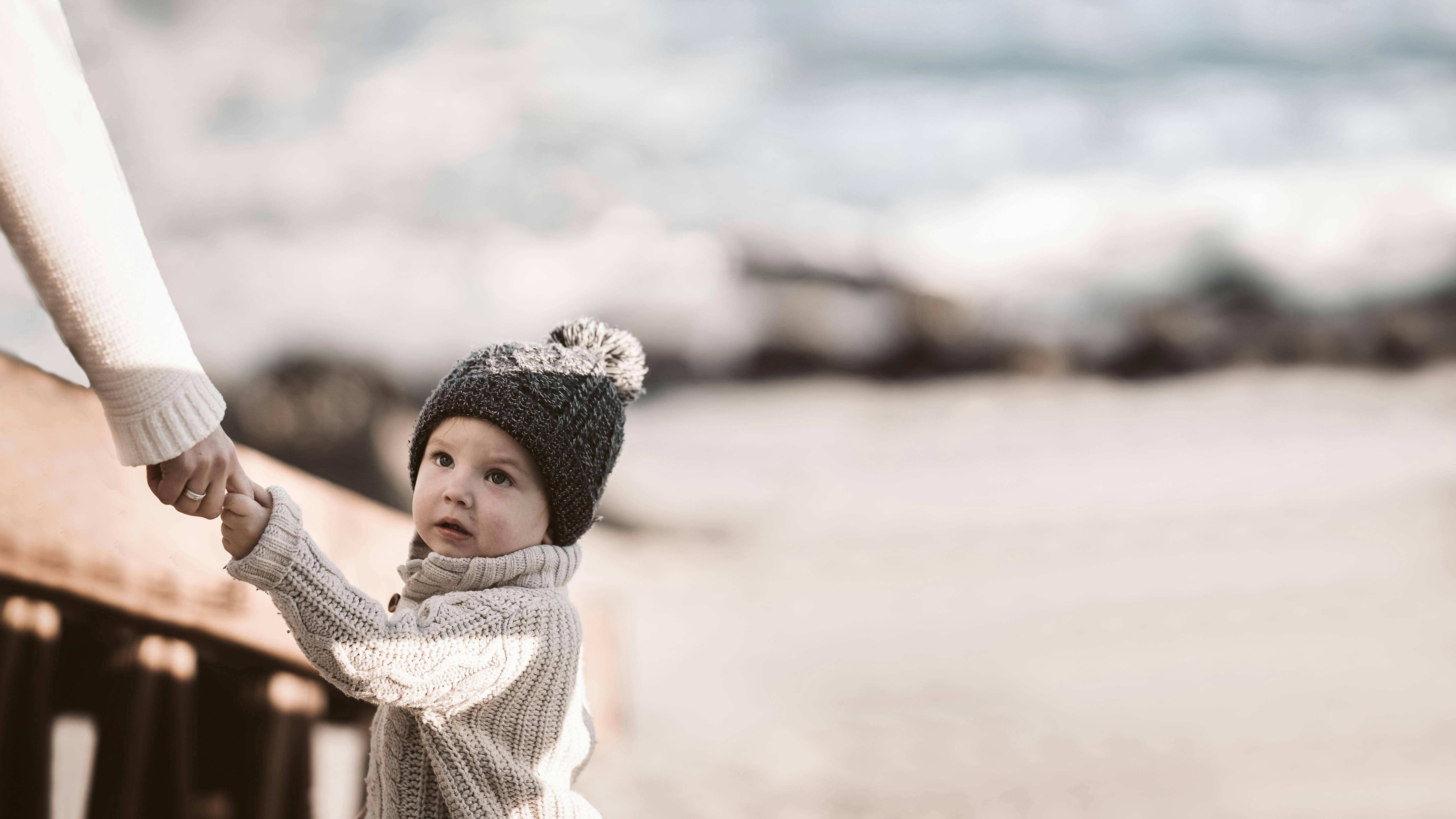 photo of baby wearing knitted beanie