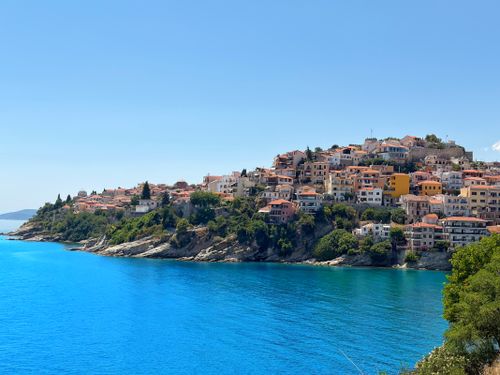 Free A stunning view of the coastal town of Kavala, Greece, featuring vibrant blue waters and historic architecture. Stock Photo