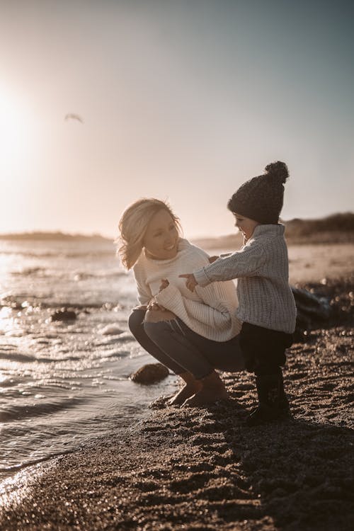 Photo Of Woman Beside Child