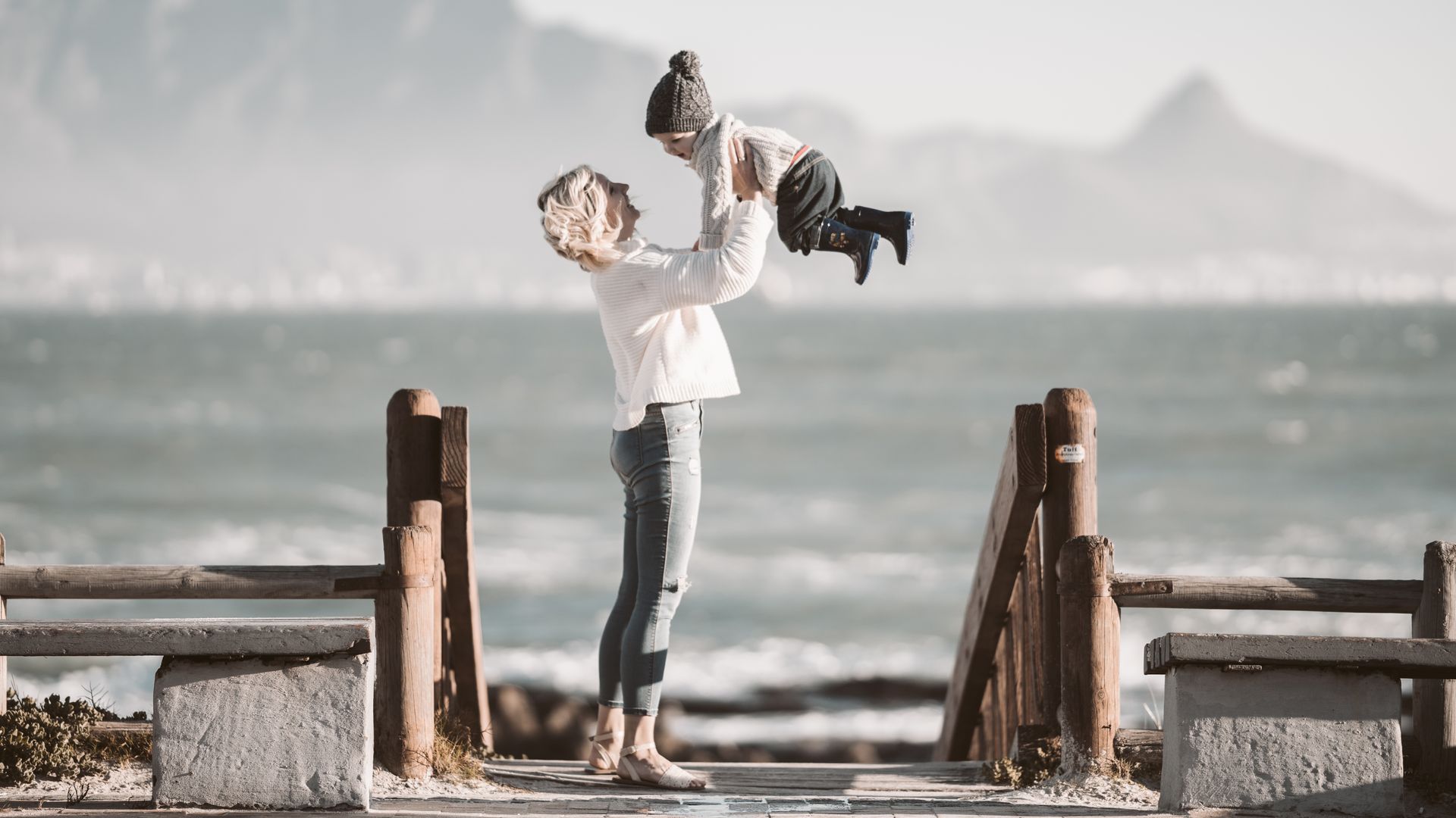 Photo Of Woman Carrying Child