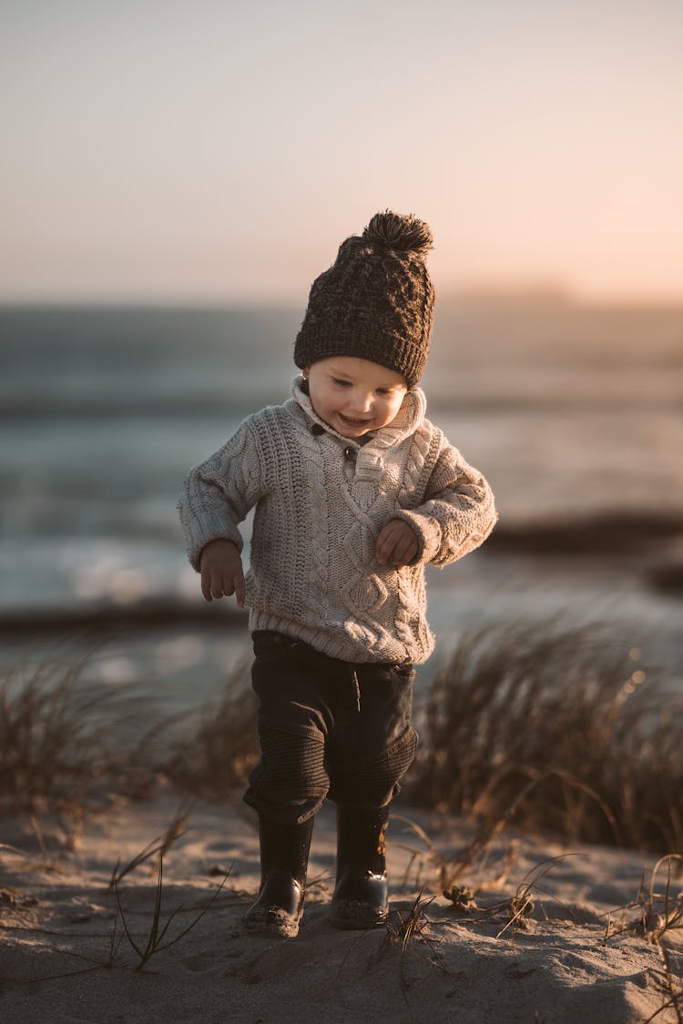 Photo Of Toddler Walking On Sand 