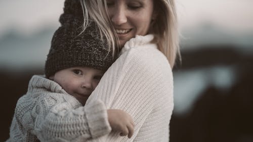 Free Photo Of Woman Carrying Toddler Stock Photo