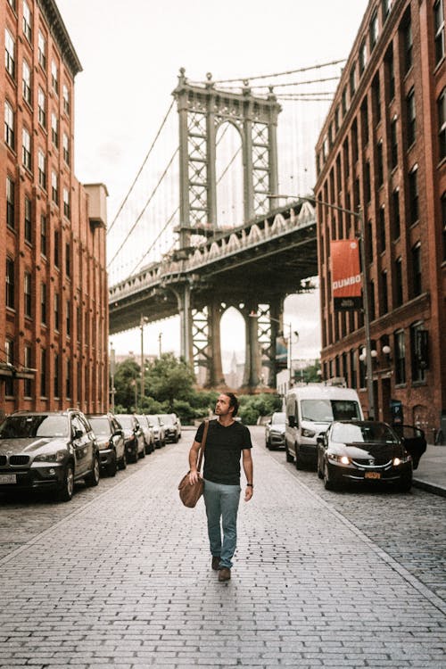 Man In Black T-shirt And Blue Denim Walking 