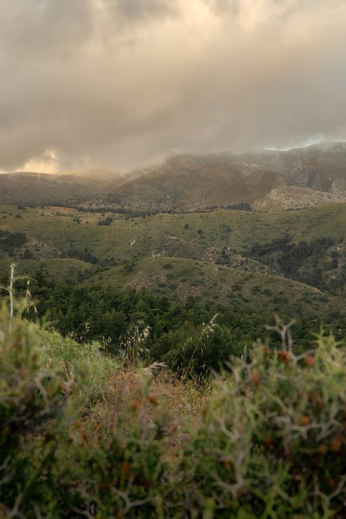 Free Breathtaking view of the lush mountains in Rhodes, Greece under dramatic cloudy sky. Stock Photo