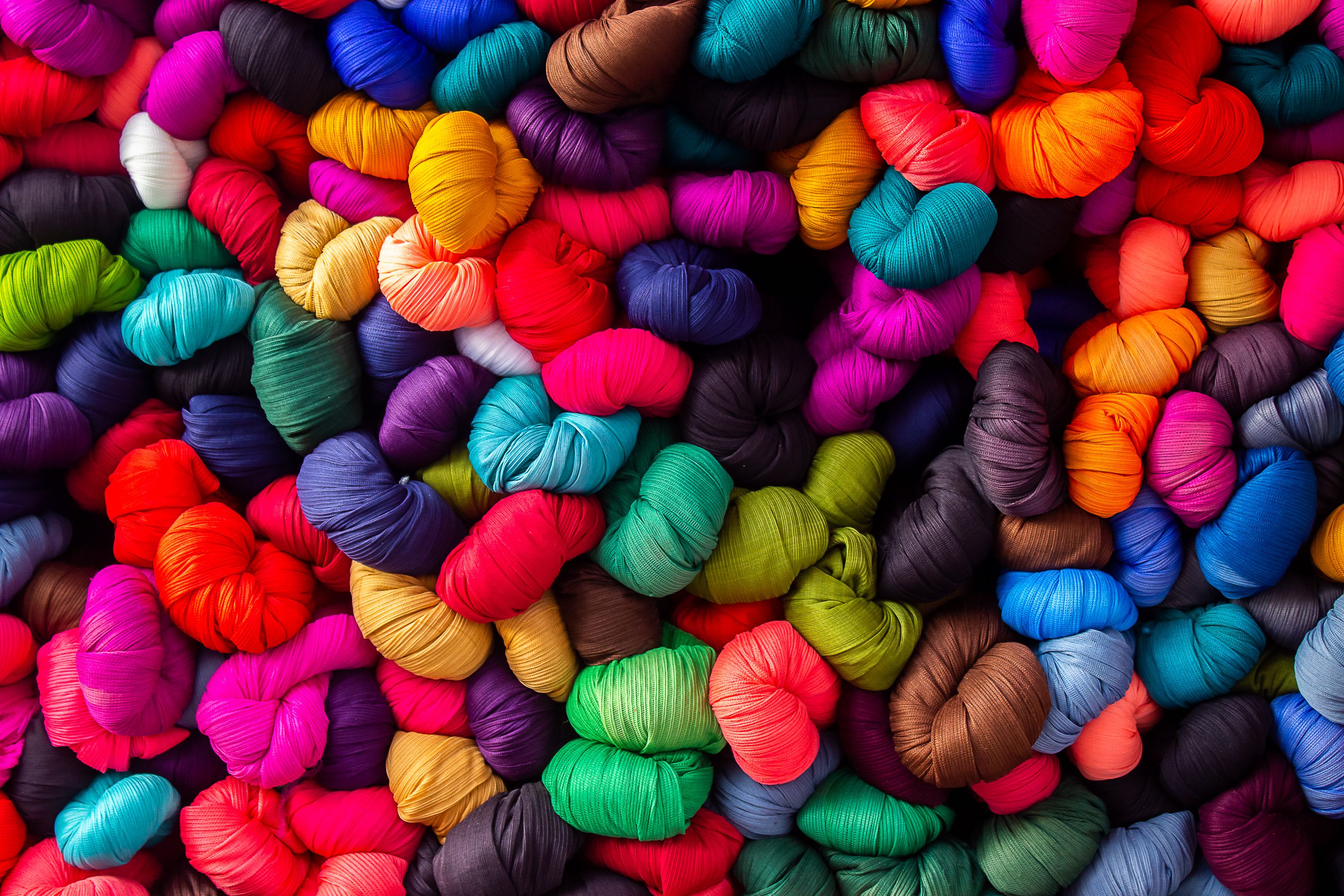 Nightshirts and pyjamas; men's or boys', of textile materials (other than cotton or man-made fibres), knitted or crocheted