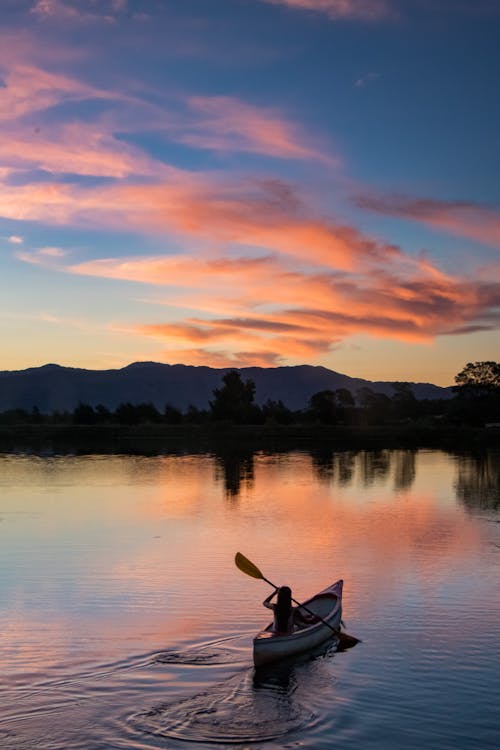 Free Photo Of Person Riding Kayak During Dawn  Stock Photo