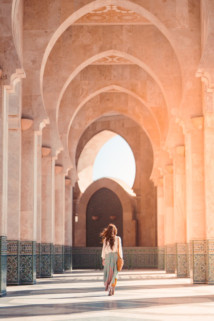 Photo Of Woman Walking On Hallway