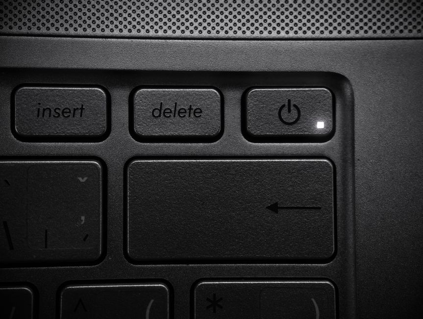 Detailed close-up of a laptop keyboard highlighting the power button and keys.