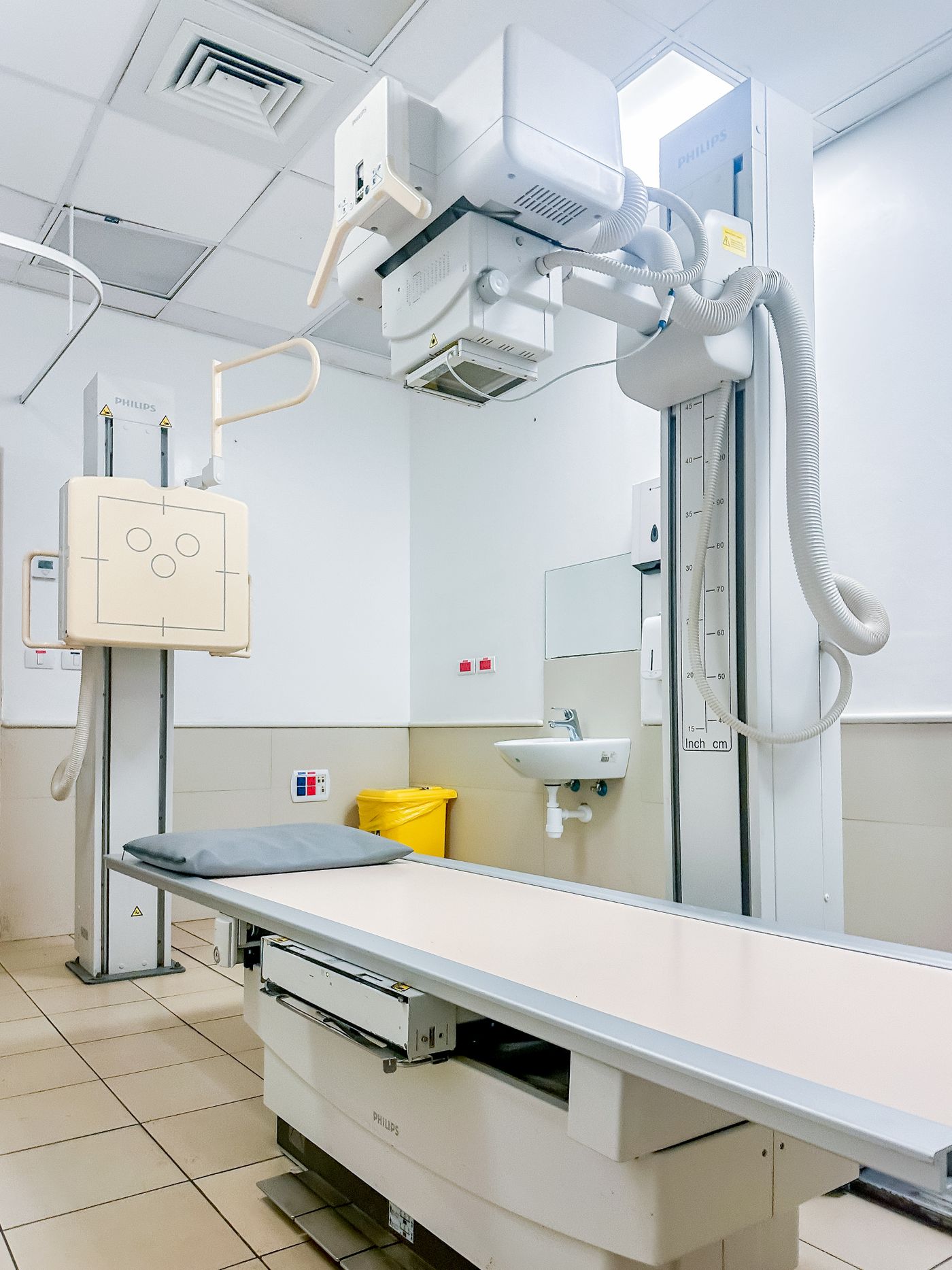 Modern hospital X-ray imaging room with radiology equipment (illustrative stock photo)
