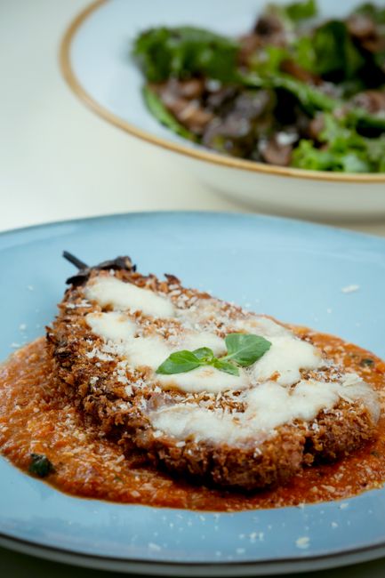 Layers of crisp breaded eggplant, marinara, and melted mozzarella and Parmesan, baked until bubbling.