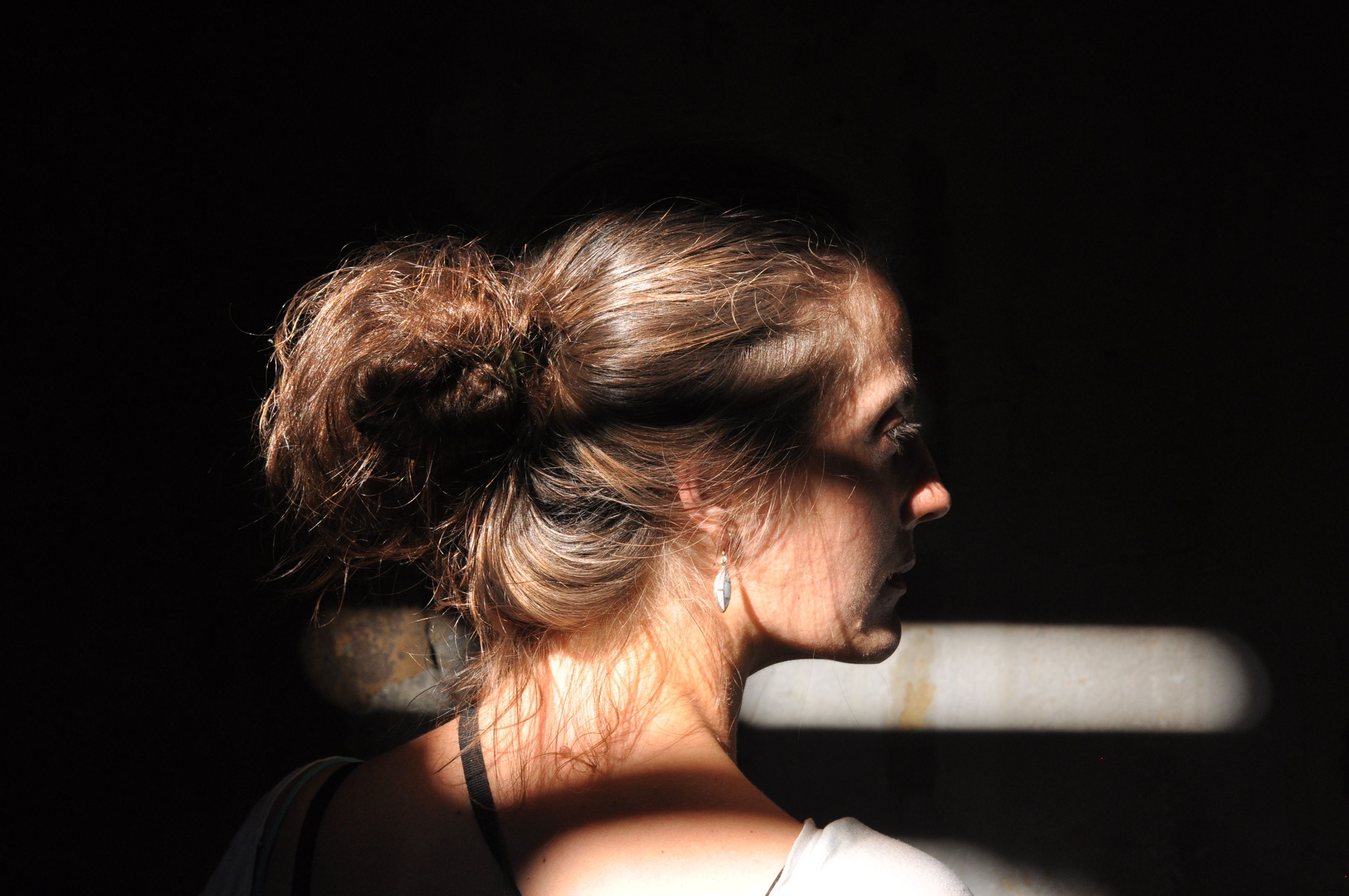close-up of neck and chest skin showing signs of photoaging including fine lines and crepey texture