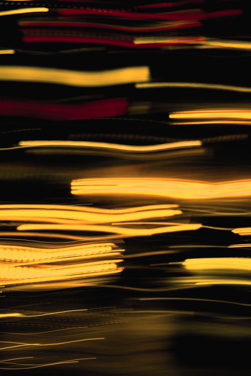 Free Dynamic light trails creating a vibrant and abstract motion effect in a dark background. Stock Photo