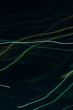 Colorful abstract light trails create dynamic motion and futuristic background in this vibrant image.