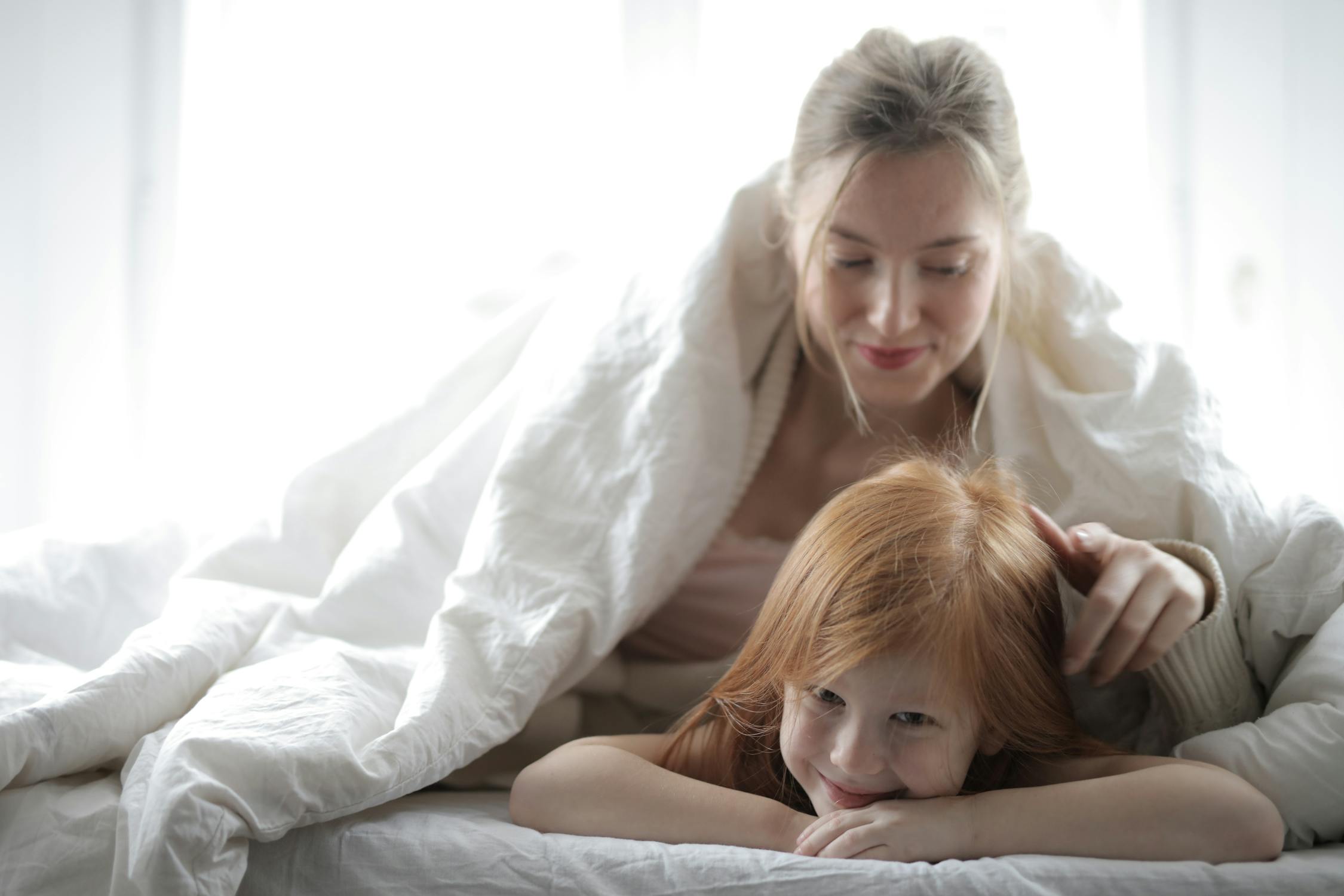 Photo Of Mother And Child On Bed · Free Stock Photo
