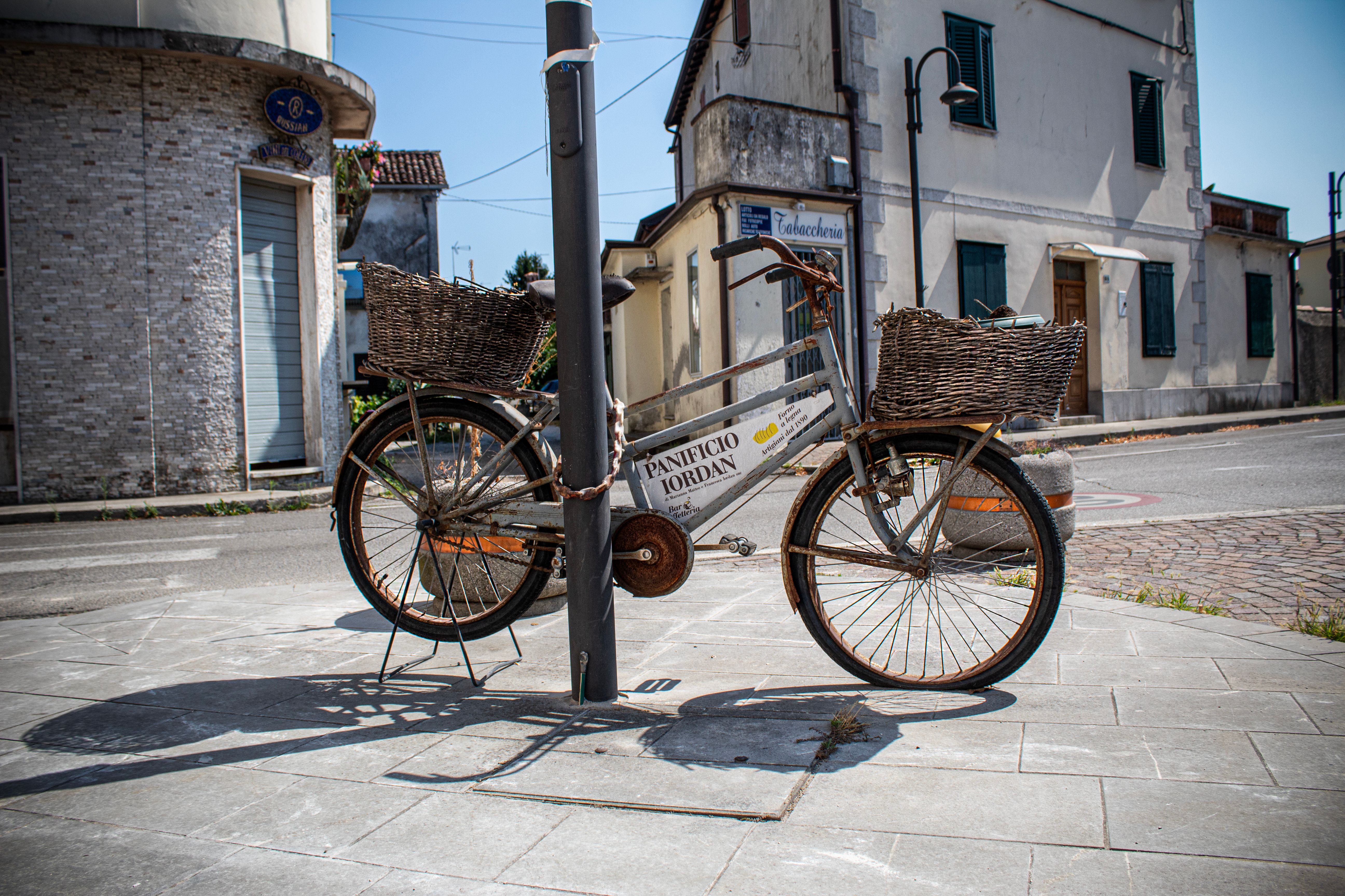 Old bicycle parked outside Panificio Iordan in Capriva del Friuli, Italy.