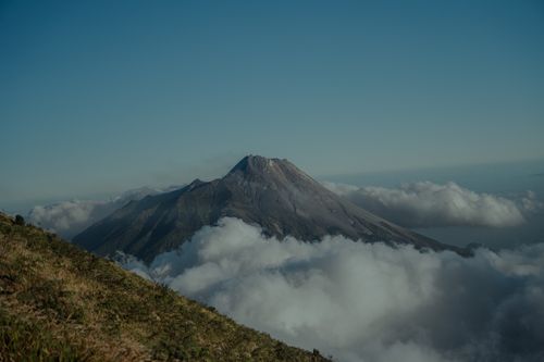 Free Stunning view of Mount Merbabu in Central Java, framed by clouds during daytime. Stock Photo