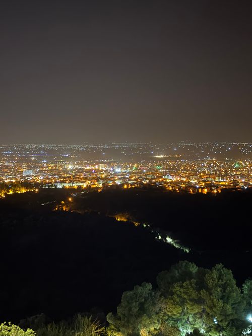 Free Stunning nighttime cityscape view of Béni Mellal, Morocco with bright city lights against the dark sky. Stock Photo