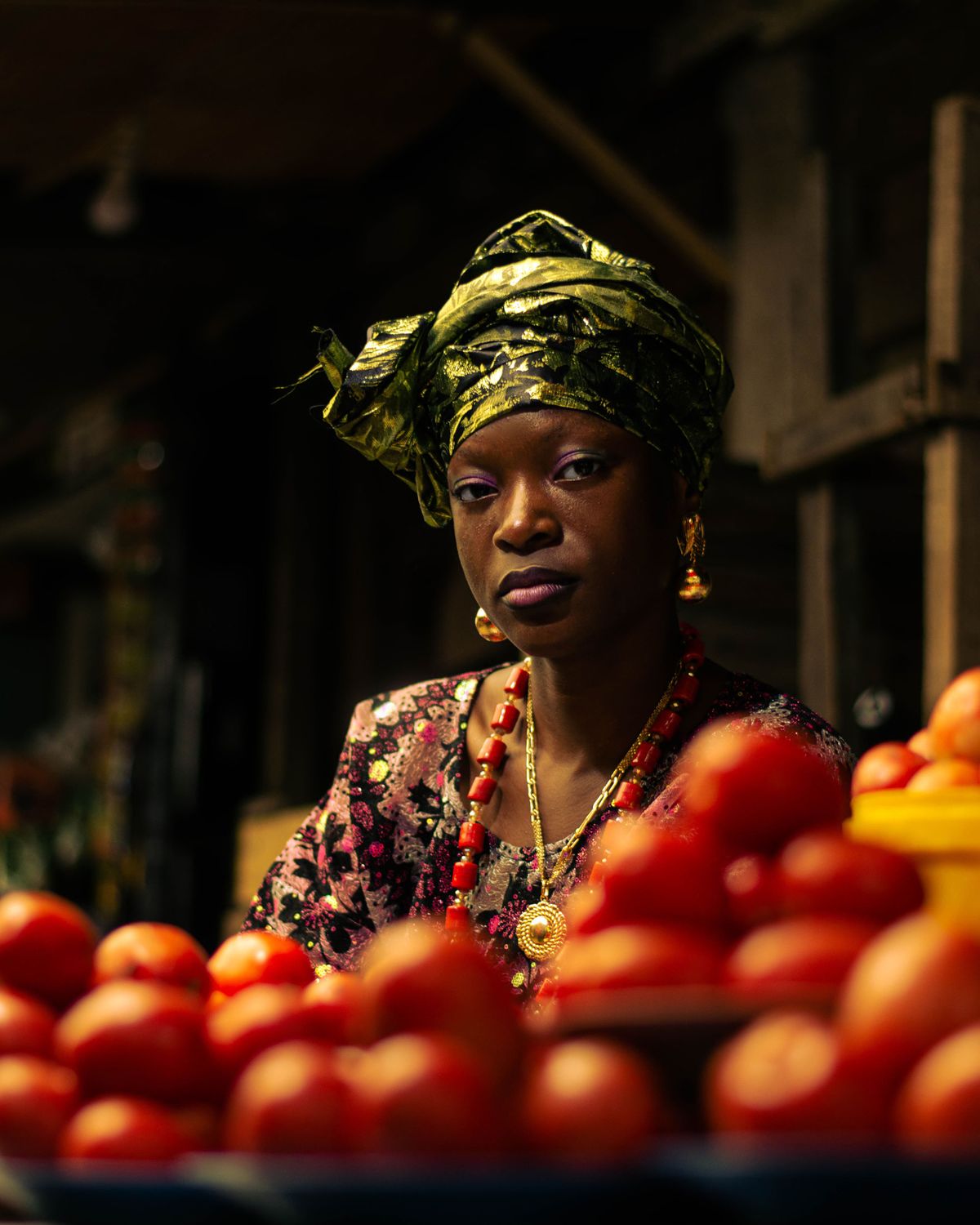 Nigerian woman selling produce at a local market
