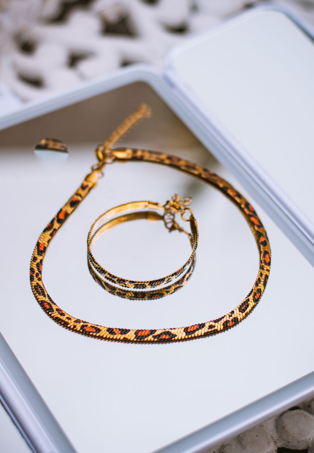 Contemporary gold necklace and bracelet