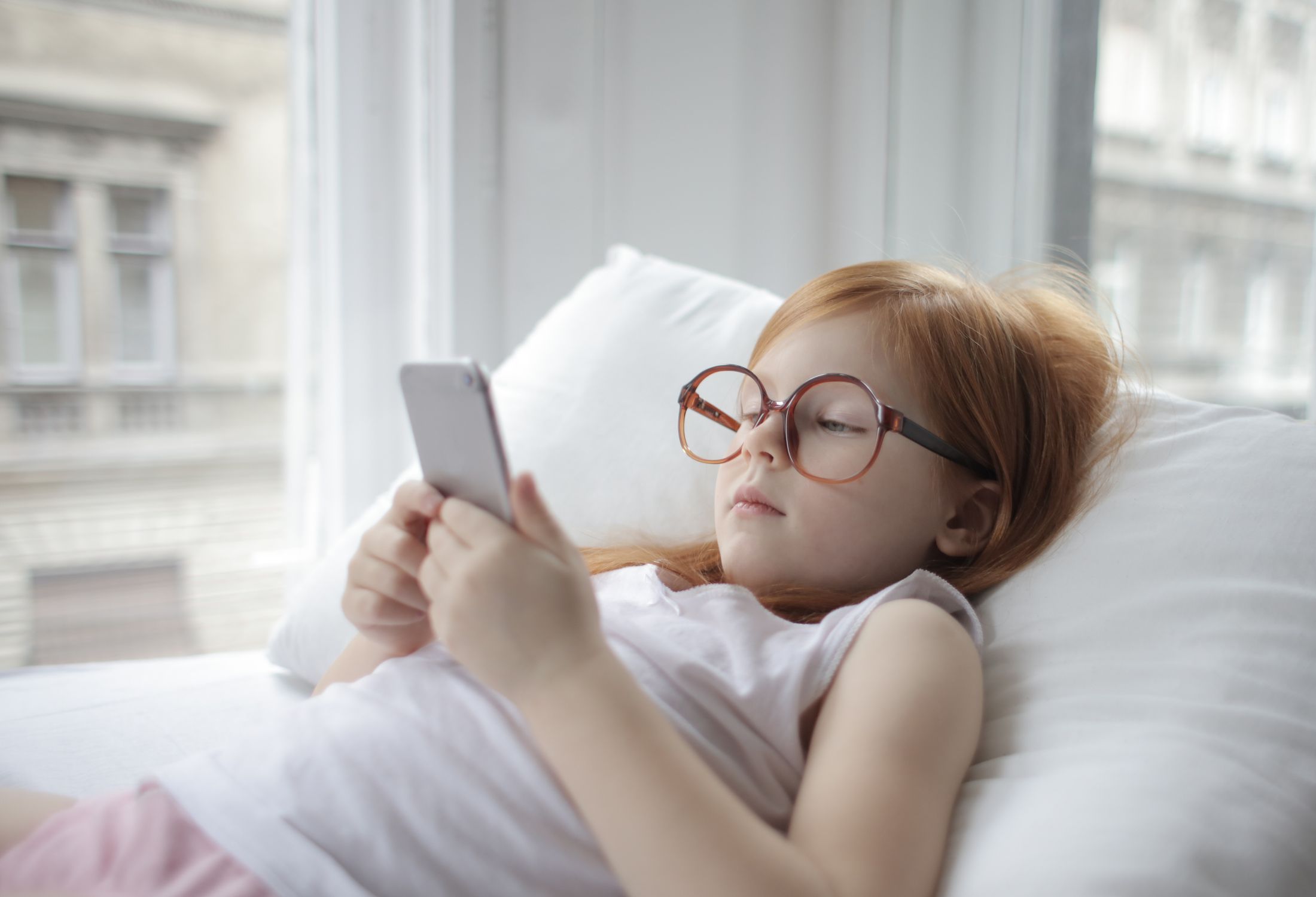 Photo Of Child Using Smartphone Free Stock Photo photo-of-child-using-smartphone-free-stock-photo