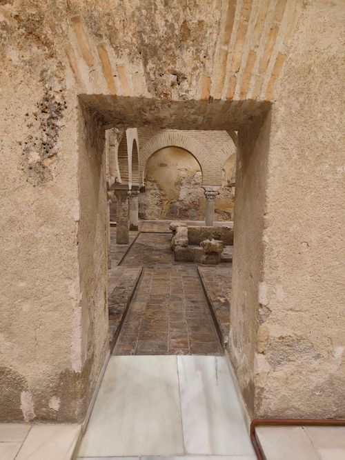 Free Interior view of historic Arab baths showing stone arches and columns in Jaén, Andalucía, Spain. Stock Photo