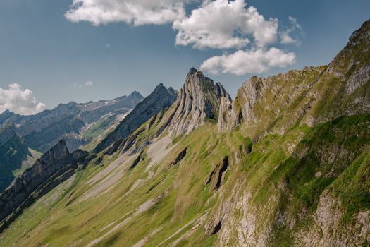 A stunning view of rugged mountain peaks under a clear sky, ideal for nature enthusiasts.