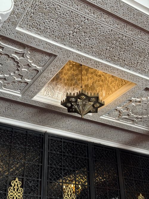 Free Ornate Moroccan ceiling and lantern in Rabat, showcasing detailed craftsmanship. Stock Photo