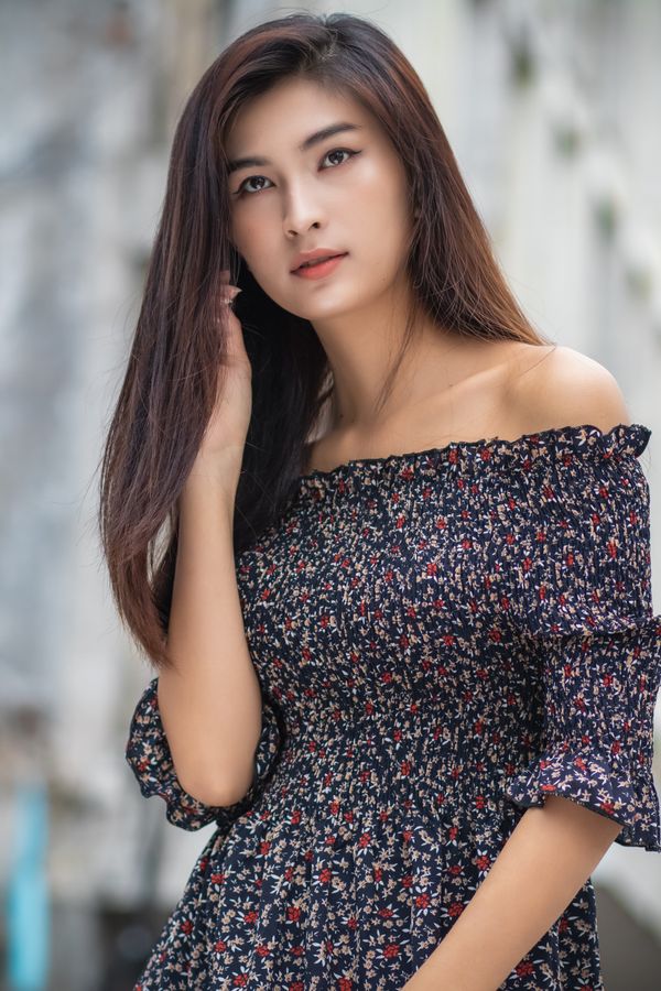 Woman wearing an off-shoulder floral midi dress